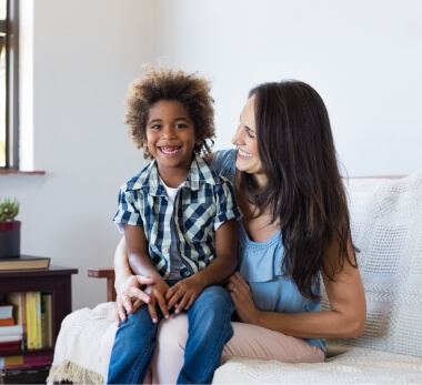 Foster child sitting on lap of foster parent